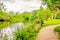 The river Wandle meandering through shady woodland