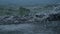 River water overflowing channel, small waves, closeup of flood in China