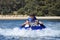 River water tubing skiing teen boy