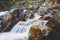 River with waterfall and stones. Mountain river in Russia