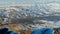 A river winds its way through snowy valley in winter Xinjiang Tianshan