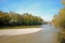 Riverside with bridge across the Isar River in Munich, Bavaria Germany