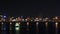 Riverside city glows at night