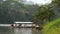 Riverside Repose: Traditional Boats Amidst Tropical Serenity