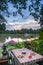 Riverside restaurant table and seats during sunset