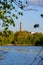 riverside shore in spring with scenic trees and green pastures