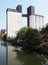 Riverside view of brighouse town with the former sugdens flour mill and grain silo now a large outdoor climbing wall and adventure