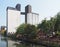 Riverside view of brighouse town with the former sugdens flour mill and grain silo now a large outdoor climbing wall and adventure