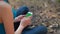 Rivne, Ukraine - April 28, 2015: A girl using phone with green screen in nature