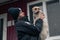 RIVNE, UKRAINE - DECEMBER 02, 2022. Police officer and homeless dog. Ukrainian female police officer takes care of stray dogs