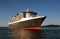 RMS Queen Mary 2 at sea at sunrise