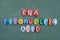 RNA, Ribonucleic acid text composed with multi colored stone letters over green sand