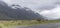 Road 94 and snow on slopes near Mackay Creek, Fiordland Park, New Zealand