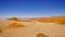 Road across salt flats in the high altitude desert of Salta`s puna region in Argentina