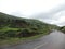 Road adjoining western Ghats of India- Monsoon season- lush greenery and cloud covered hills