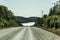 Road through Algonquin Provincial Park towatds lake beginning fall Ontario Canada