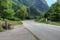 Road Alps mountains alpine landscape summer travel turn empty highway nature green forest rural way country trip route journey car