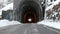 Road with ancient stone tunnel in winter scenic