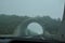 Road arch in the fog, a tunnel in the mountains