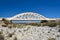 A road arched bridge over a dried river