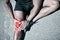 Road, athlete and knee injury in closeup from exercise with emergency from workout with massage. Sportsman, outdoor and