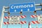 Road barricades near Cremona city road sign. Lockdown in Italy conceptual 3D rendering