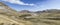 Road bending downhill on barren slopes at Campo Imperatore,  from west, Abruzzo, Italy