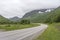 Road bending in green landscape, near Lodingen, Norway