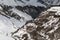 Road bends in the snowy mountains. Winter time. Monochrome