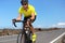 Road bike cyclist man sport athlete training cardio workout on racing bicycle. Male biker biking outdoors training