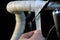 Road bike handlebars and dual control lever on a black background. Install handlebar tape white. Bicycle repair in a modern