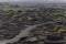 Road through the black vineyards in La Geria. Growing vine in lava, black is beautiful, background, Lanzarote, Spain