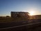 Road Bobruisk-Minsk, BELARUS 18.06.19: Intercity passenger bus transports passengers on the highway at sunset