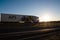 Road Bobruisk-Minsk, BELARUS 18.06.19: Truck driver drives a truck with a semitrailer against the background of blue sky