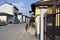 Road bordered by houses with a church at the end of it on a sunny day in a village in the italian countryside