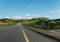 Road-bridge over the Keve river surrounded by hills and greenery in Angola