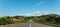 Road-bridge surrounded by hills and greenery over the Keve River in Angola