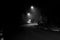 Road in Campos do JordÃ£o photographed at night with fog in black and white