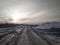 Road for cars passage to an industrial coal pit in Siberia in winter