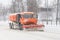 Road cleaning snow-removing machine in the city after huge snowfall.