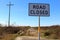 Road closed sign at the end of Texas Highway 87