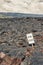 Road closed sign and highway damaged by lava