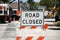 Road closed sign on street