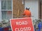 Road closed sign traffic no entry workers worker repairs construction maintenance