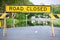 Road closed traffic sign on flooded road