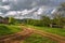 Road, clouds, village. Russian steppe.