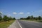 Road conditions, trees, roadside, sky, beautiful white clouds