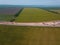 Road Construction Site near the highway with machinery, bulldozer, excavation from above. 4K video, top down view.