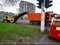 Road construction work with paver and compactor. Removing asphalt and loading it into a truck