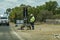 Road Construction Worker Overseeing Highway Traffic Lights